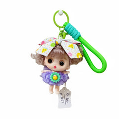 mini doll keychain with a bow and skirt