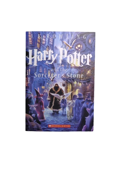Harry Potter and the sorcerer's stone by j. K. Rowling